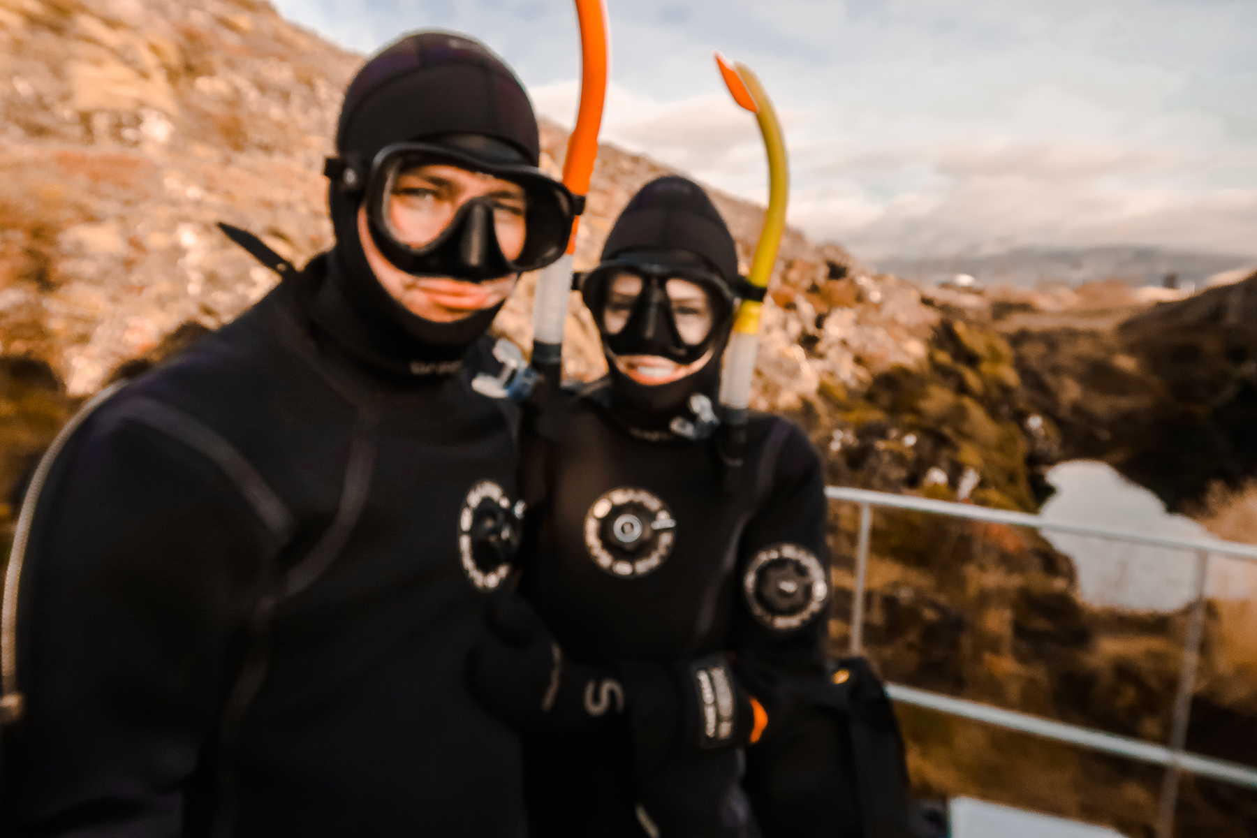 Alyssa Campanella and Torrance Coombs of The A List experience snorkeling Silfra with DIVE.IS in Iceland