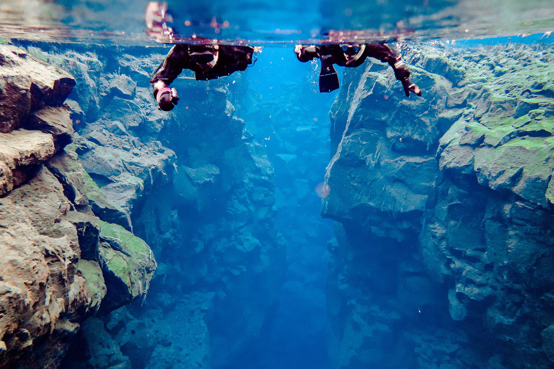 Alyssa Campanella and Torrance Coombs of The A List experience snorkeling Silfra with DIVE.IS in Iceland