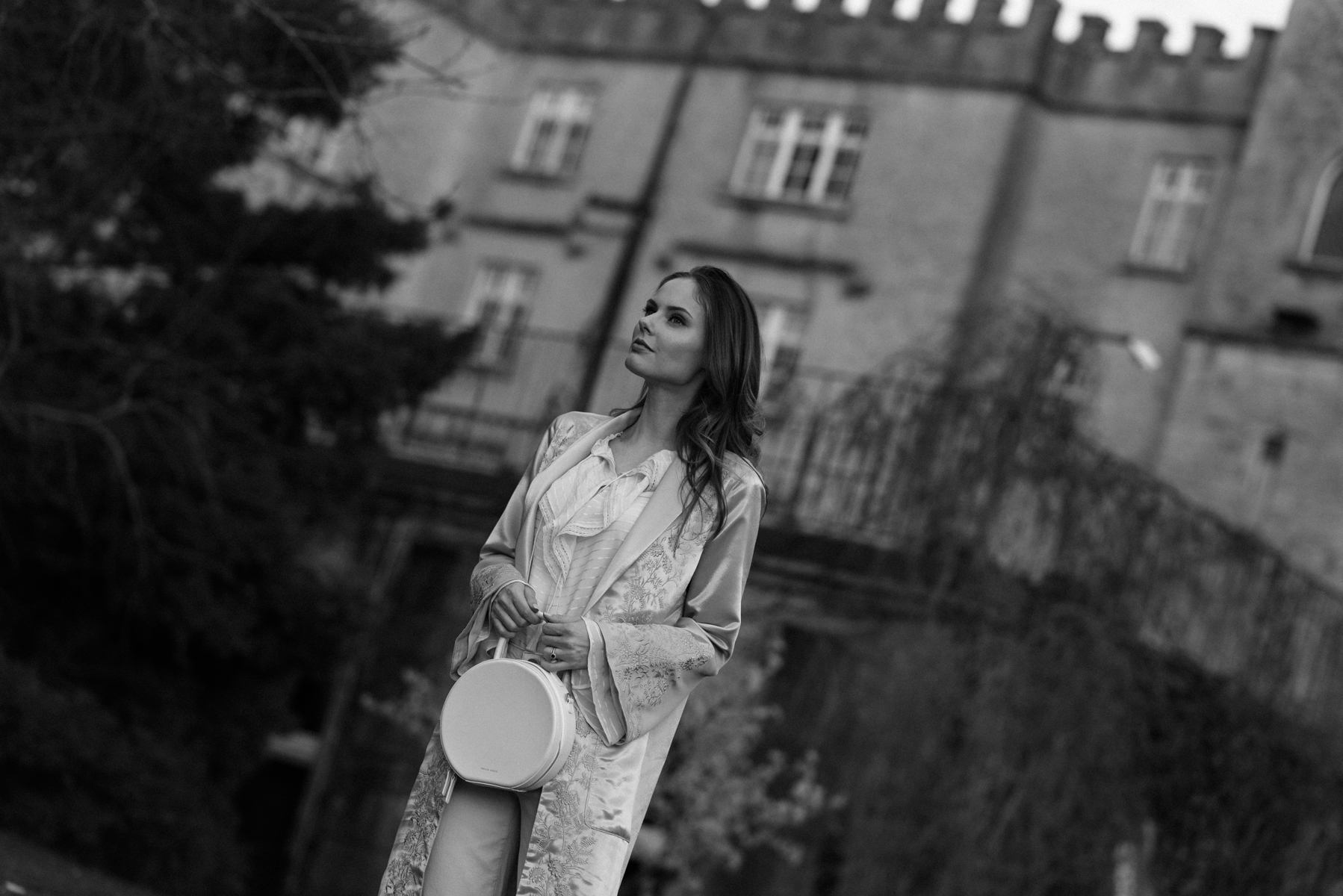 Alyssa Campanella of The A List blog wears the Maryella coat from Paige denim at the romantic Irish castle Cabra Castle in Ireland