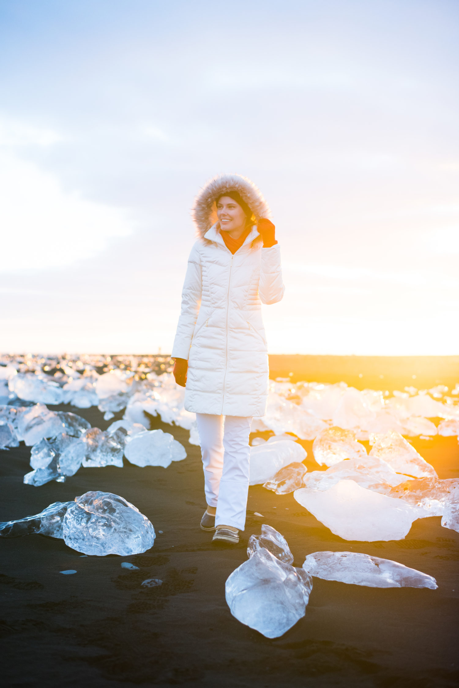 Miss USA 2011 Alyssa Campanella of The A List blog wearing Ellen Tracy faux fur coat and Sorel Caribou boots and North Face APEX snow pants in Jökullsárlón, Iceland