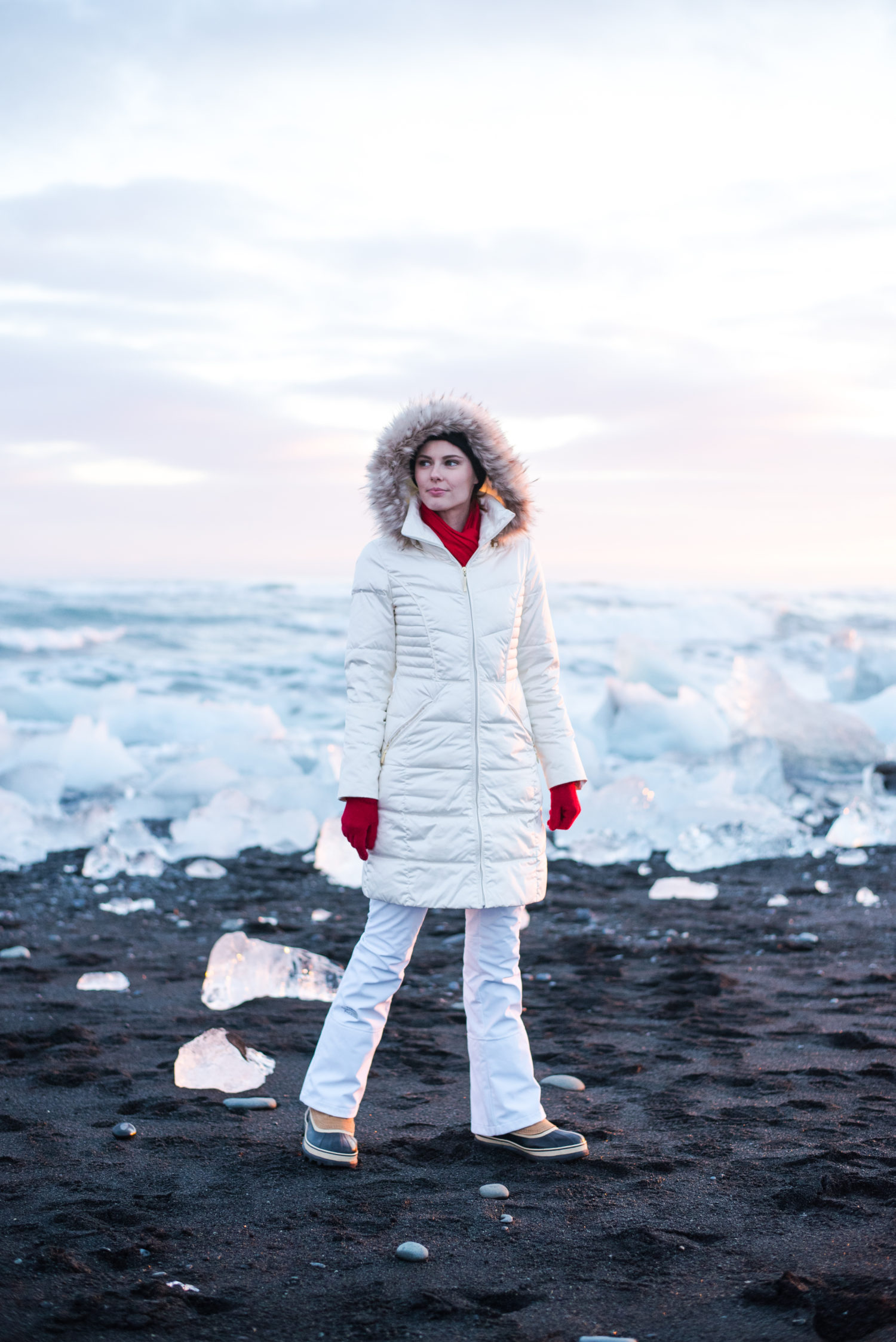 Miss USA 2011 Alyssa Campanella of The A List blog wearing Ellen Tracy faux fur coat and Sorel Caribou boots and North Face APEX snow pants in Jökullsárlón, Iceland