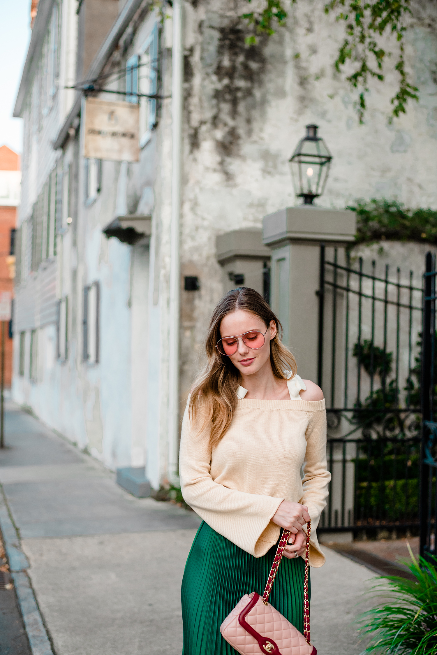Alyssa Campanella of The A List blog's 48 Hours in Charleston itinerary wearing Club Monaco green pleated Annina skirt