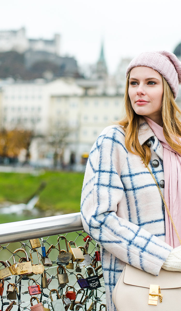 Alyssa Campanella of The A List blog sharing her favorite coats for fall and winter wearing Rebecca Minkoff in Austria