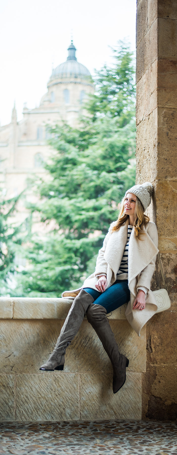 Alyssa Campanella of The A List blog sharing her favorite coats for fall and winter wearing Amanda Uprichard coat in Spain
