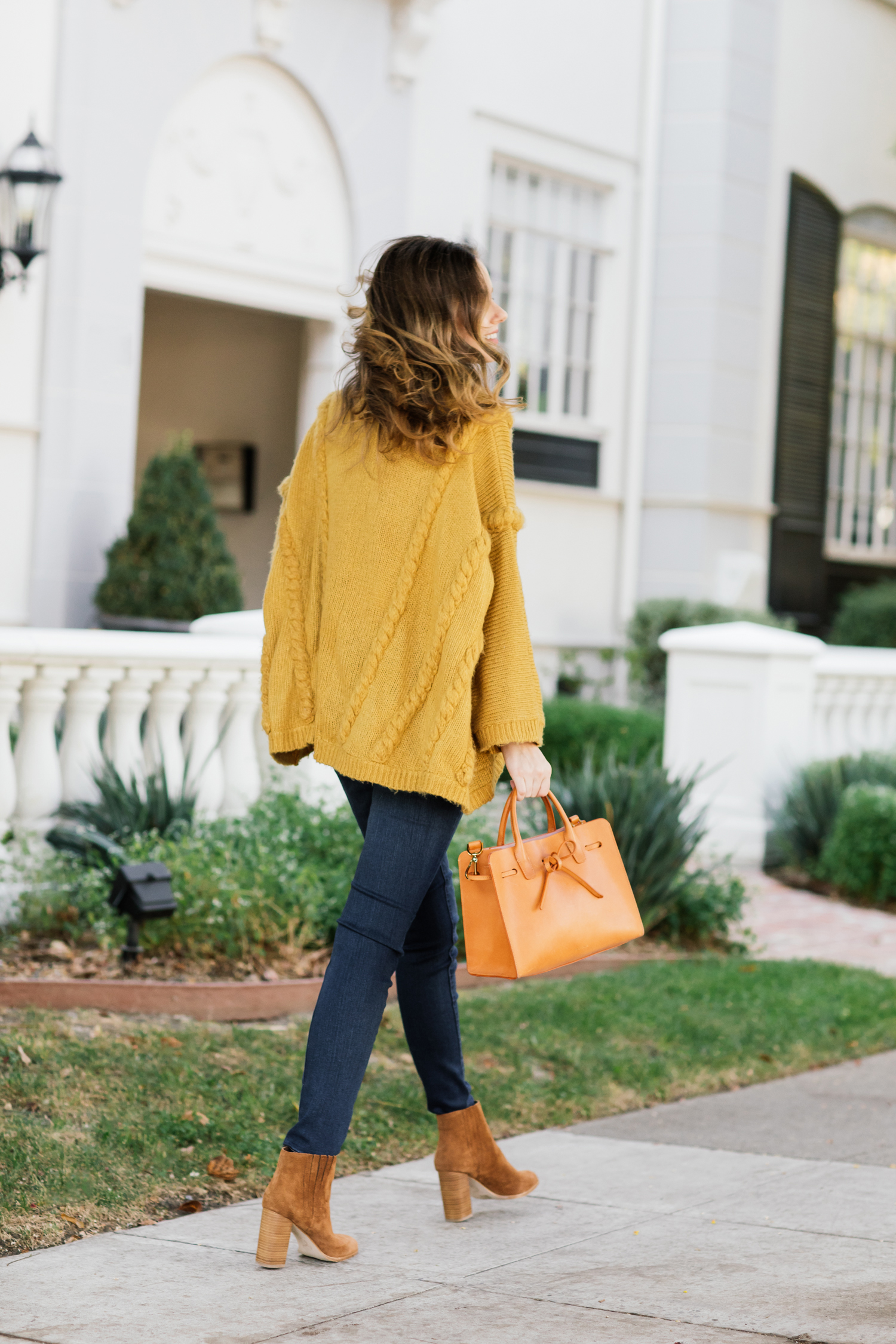Alyssa Campanella of The A List blog wearing a cozy yellow cardigan and Joie Yara boots for fall