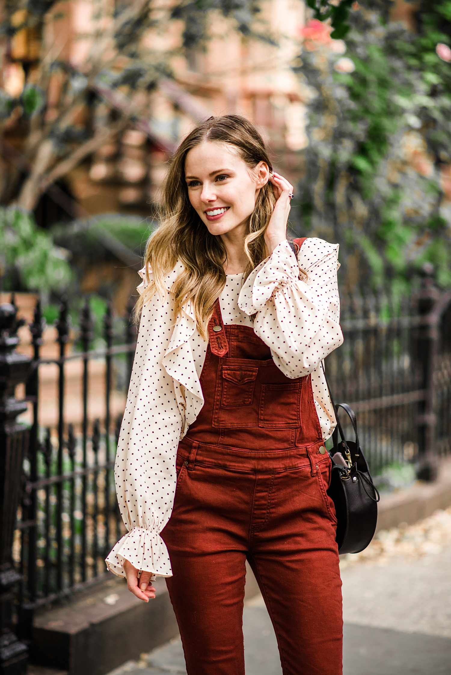 Alyssa Campanella of The A List blog enjoys autumn in New York wearing Free People washed denim overalls and Clare V Alistair bag