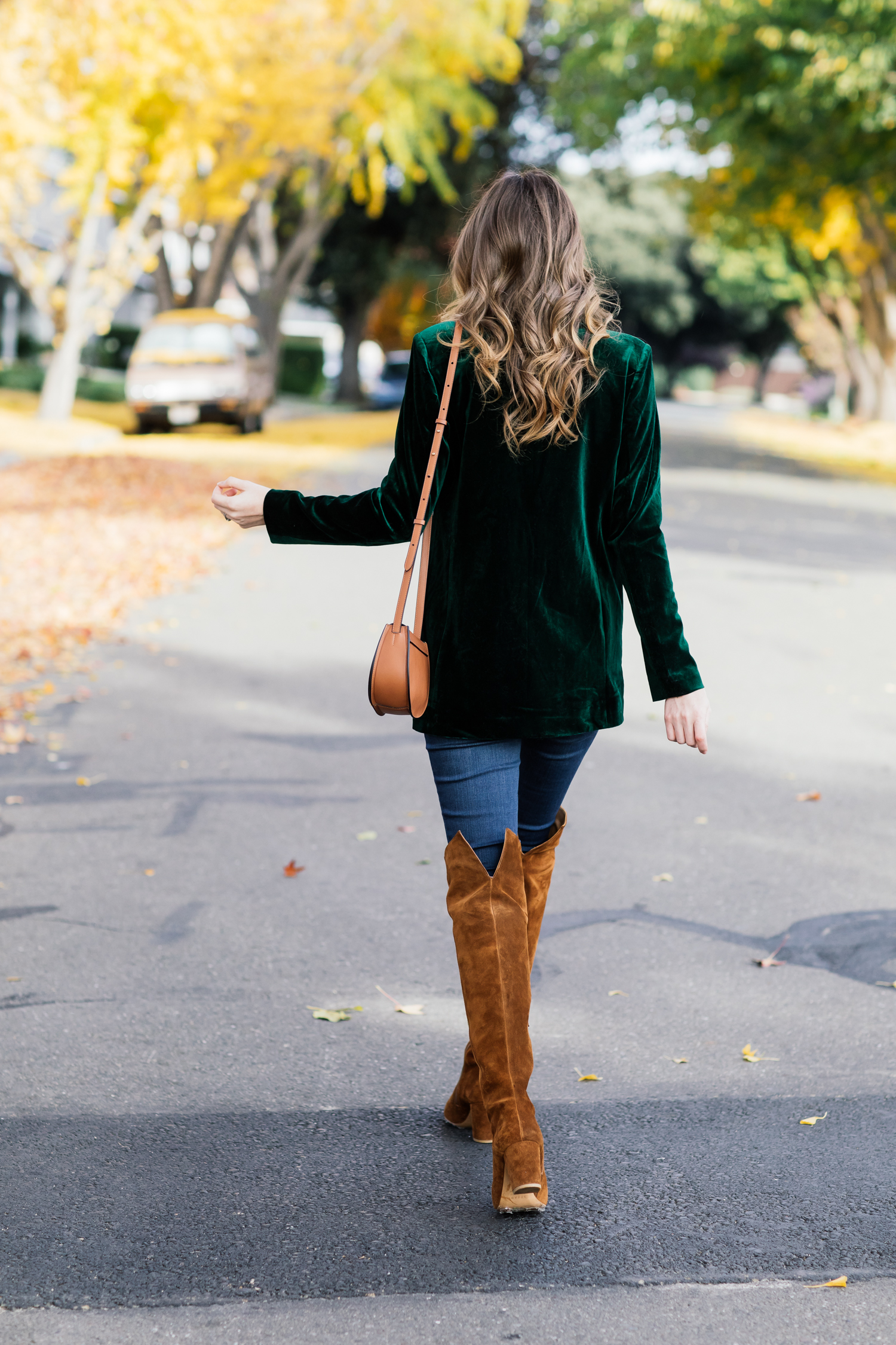 Alyssa Campanella of The A List blog shares the best velvet blazers for the holidays wearing On Parle de Vous green blazer, Cuyana mini saddle bag, and Sezane Emilie boots.