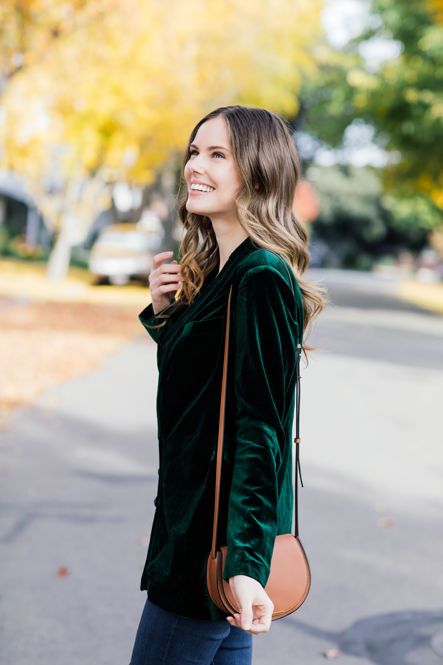 Alyssa Campanella of The A List blog shares the best velvet blazers for the holidays wearing On Parle de Vous green blazer, Cuyana mini saddle bag, and Sezane Emilie boots.