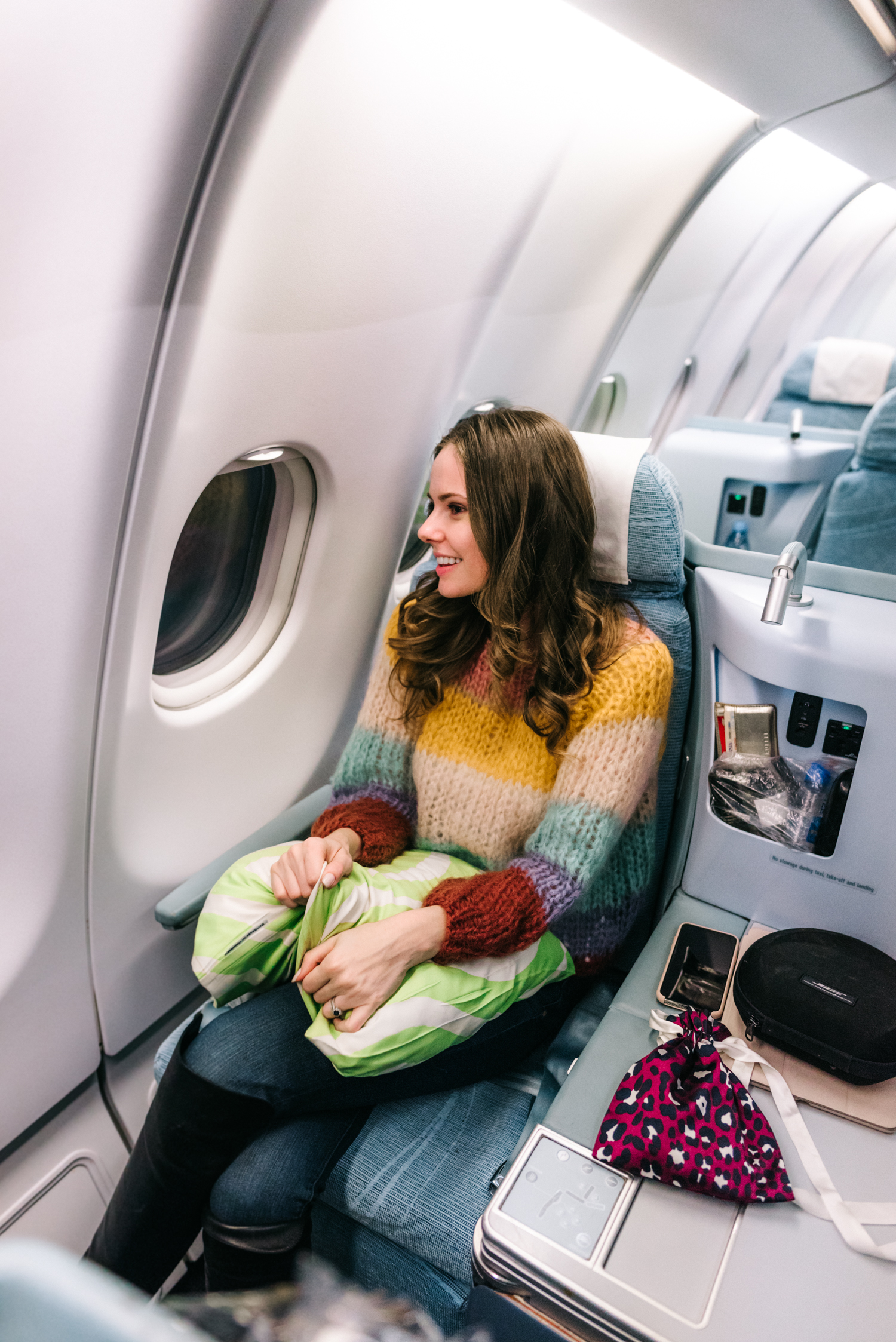 Alyssa Campanella of The A List blog flies to Finland with Finnair wearing Maiami striped sweater