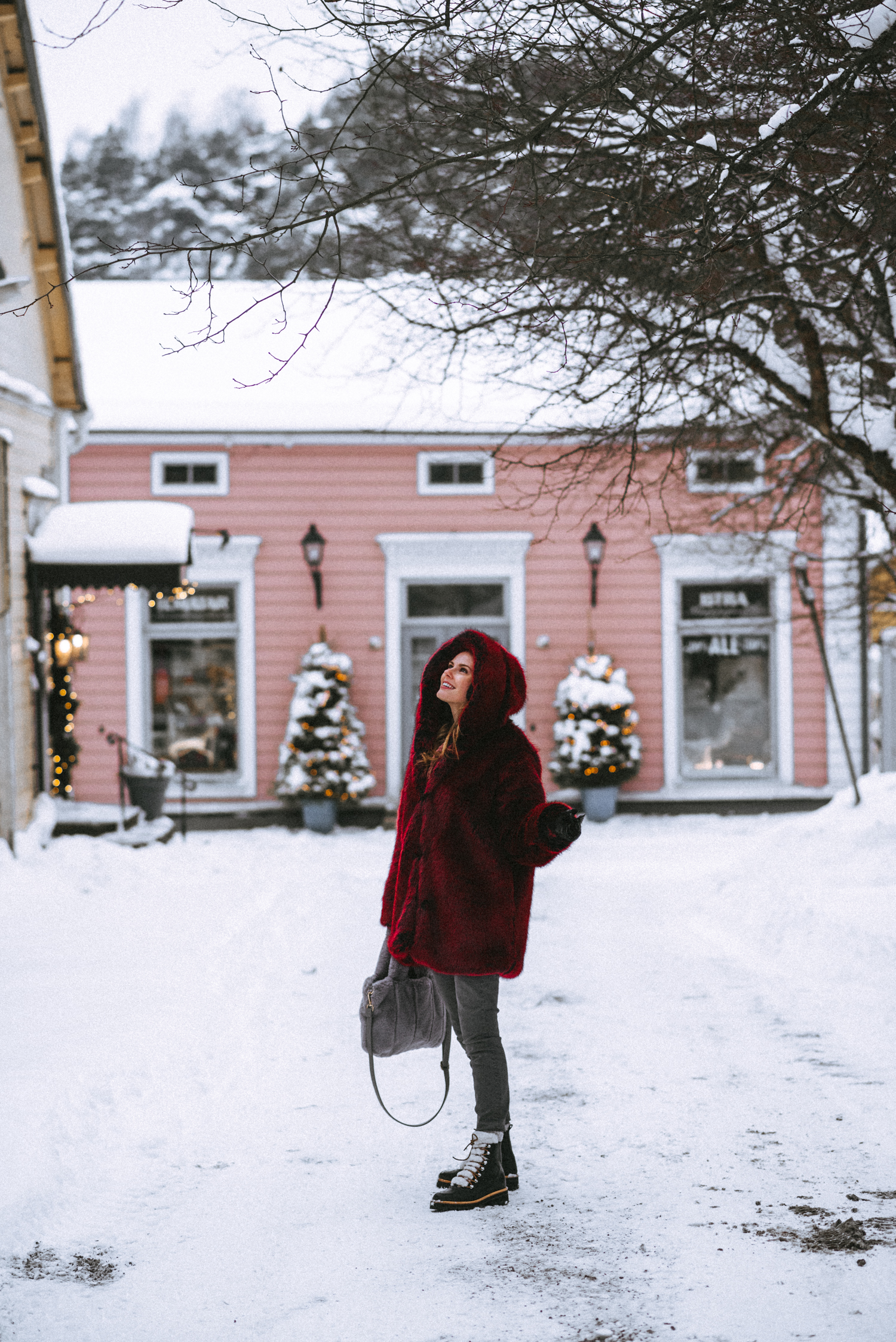 Alyssa Campanella of The A List blog wears the faux fur LPA Coat 84 and Marc Fisher Izzie boots while enjoying a day trip to Porvoo, Finland