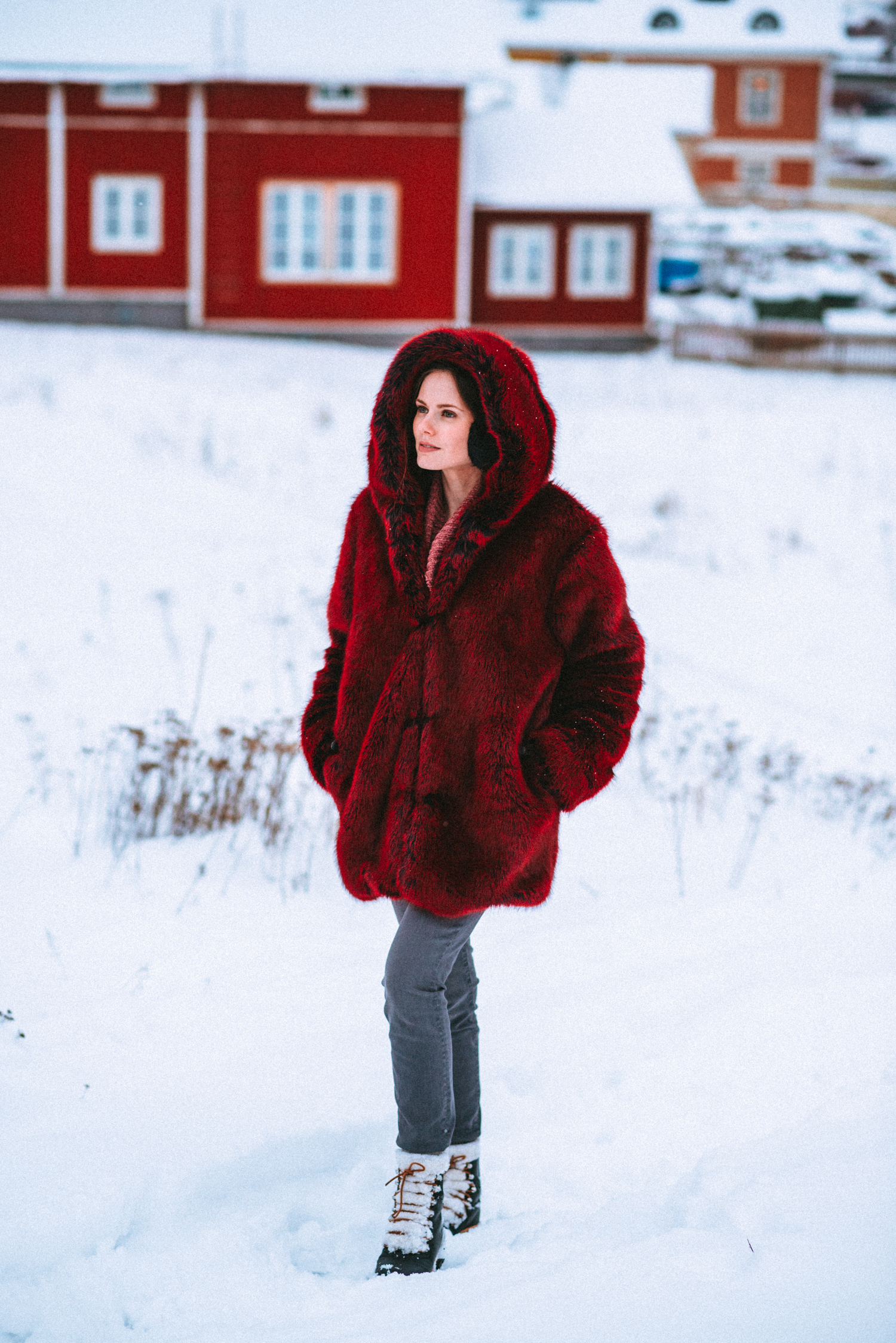 Alyssa Campanella of The A List blog wears the faux fur LPA Coat 84 and Marc Fisher Izzie boots while enjoying a day trip to Porvoo, Finland