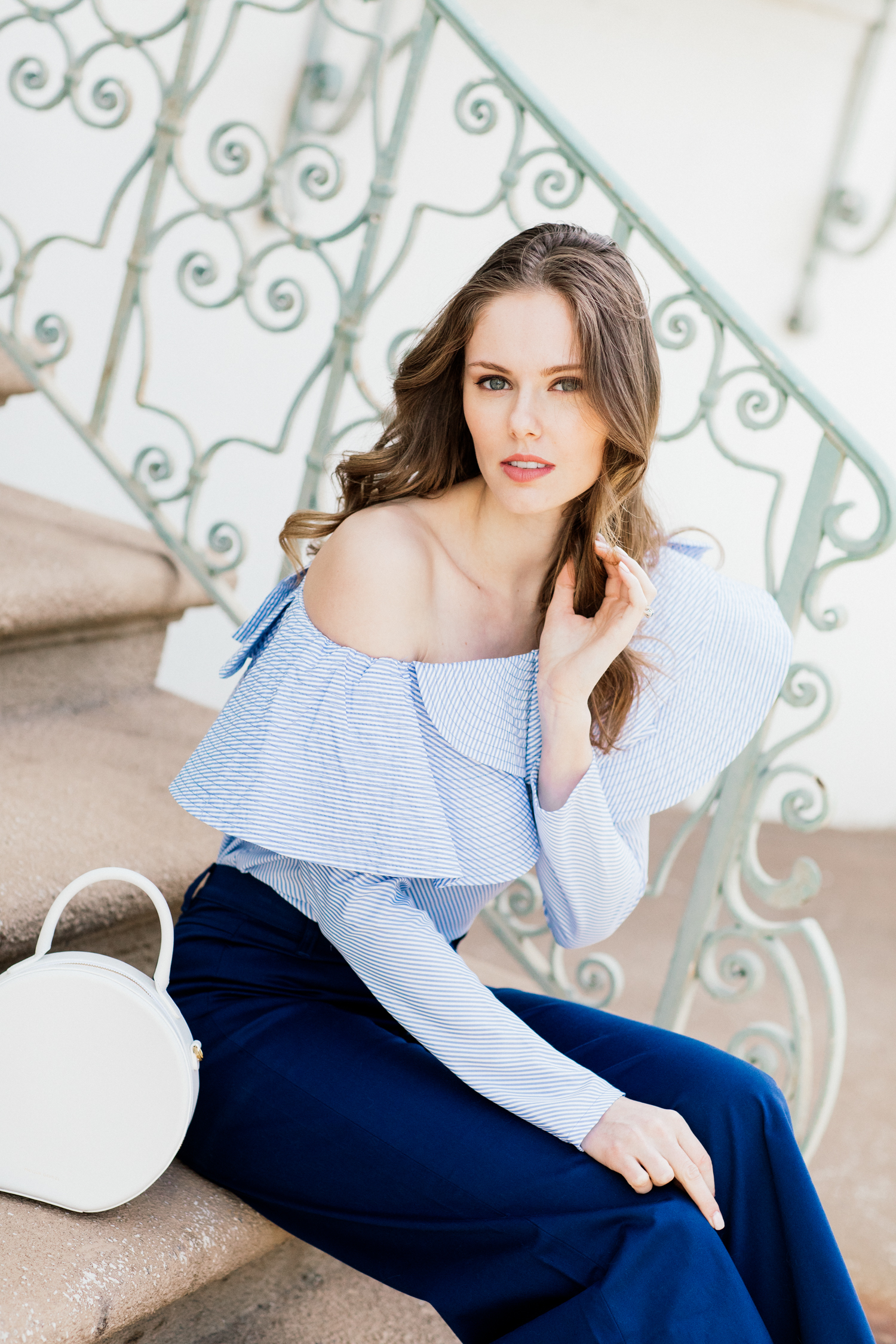 Alyssa Campanella of The A List blog shares white accessories for spring in Staud Novak pants and Mansur Gavriel white circle bag