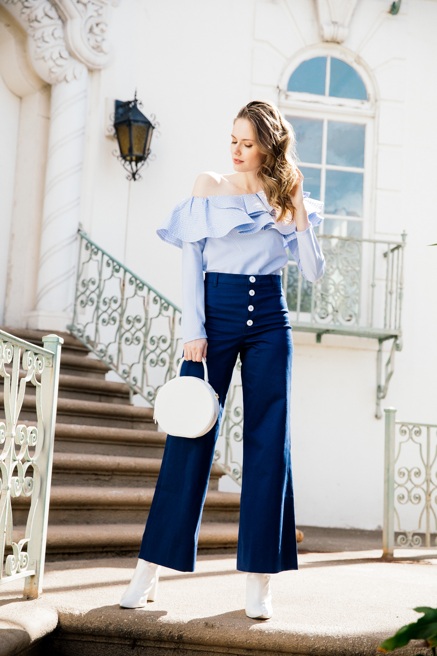 Alyssa Campanella of The A List blog shares white accessories for spring in Staud Novak pants and Mansur Gavriel white circle bag