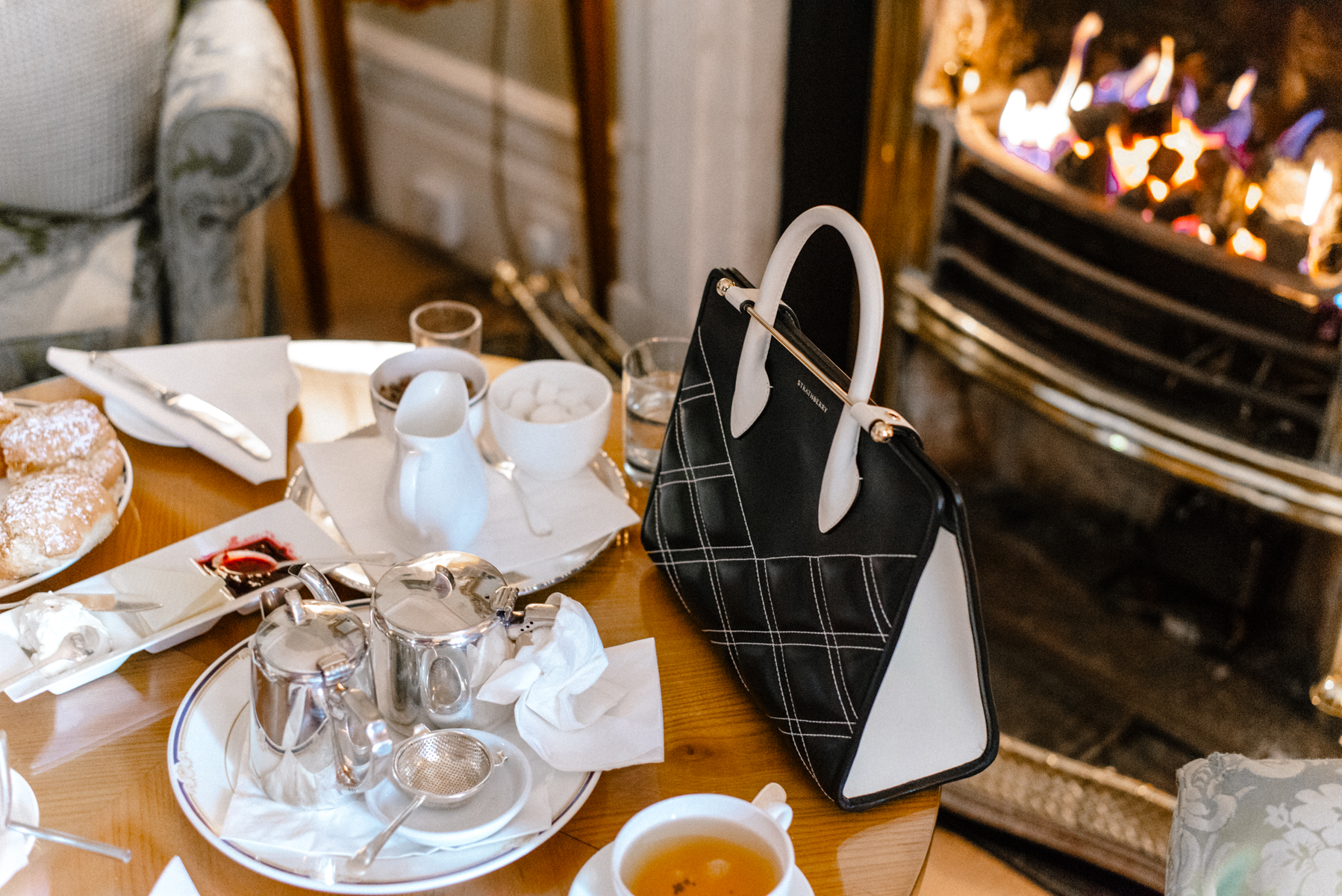 Alyssa Campanella of The A List enjoys afternoon tea at Marlfield House with the Strathberry Quilted Midi Tote Bag