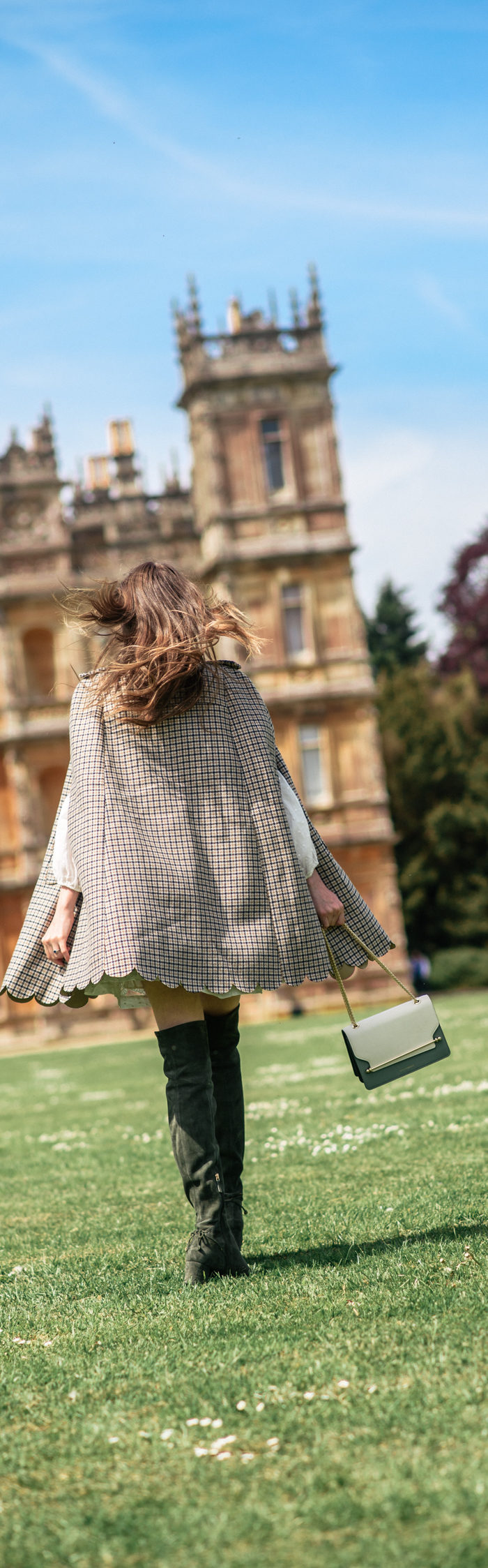 Alyssa Campanella of The A List blog visits Downton Abbey locations at Highclere Castle wearing RED Valentino plaid cape and Strathberry East West bag