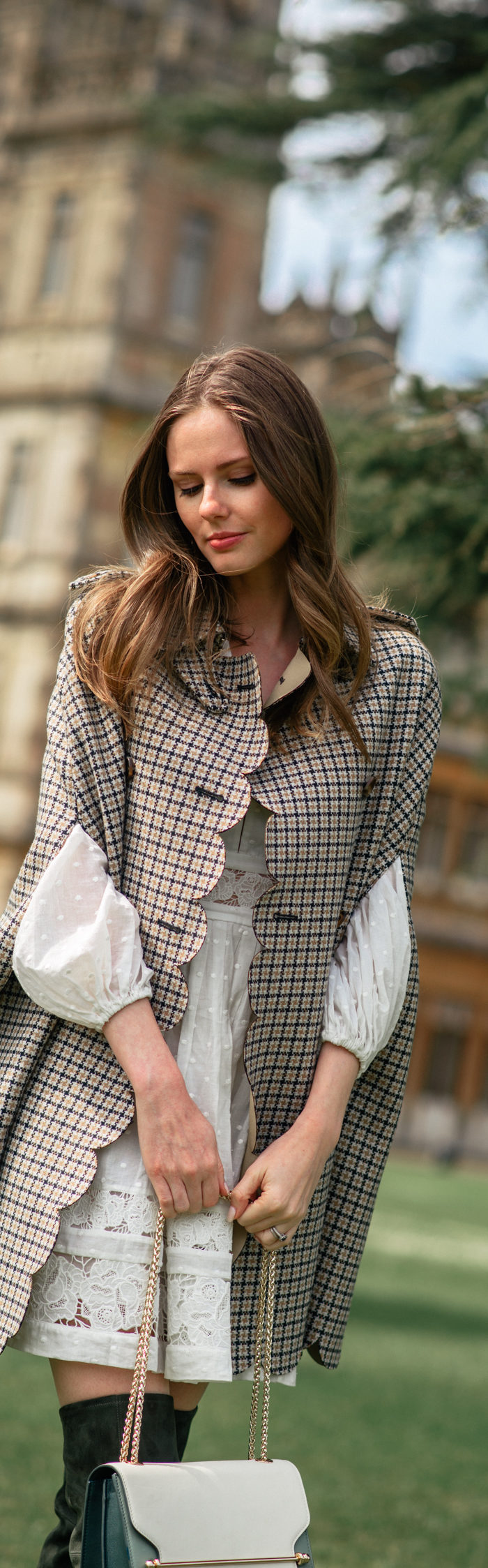 Alyssa Campanella of The A List blog visits Downton Abbey locations at Highclere Castle wearing RED Valentino plaid cape and Strathberry East West bag