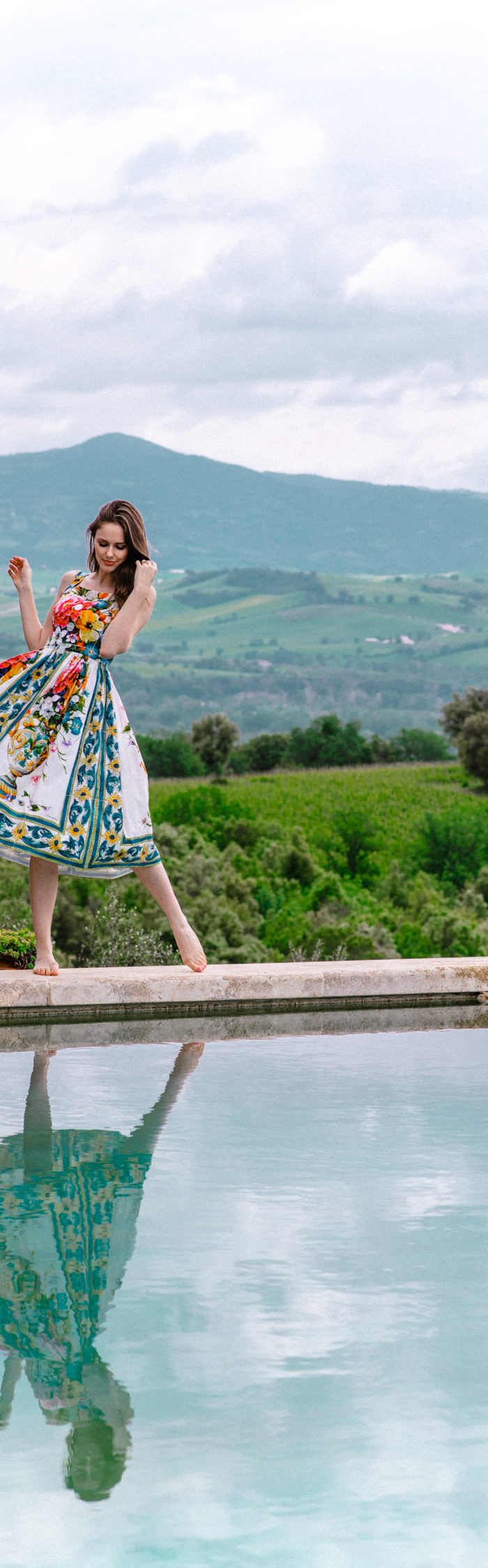 Alyssa Campanella of The A List visits Castello di Vicarello in Tuscany, Italy wearing Dolce & Gabbana Majolica dress