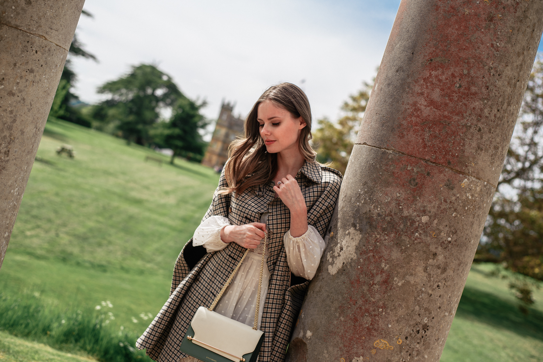 Alyssa Campanella of The A List blog visits Downton Abbey locations at Highclere Castle wearing RED Valentino plaid cape and Strathberry East West bag