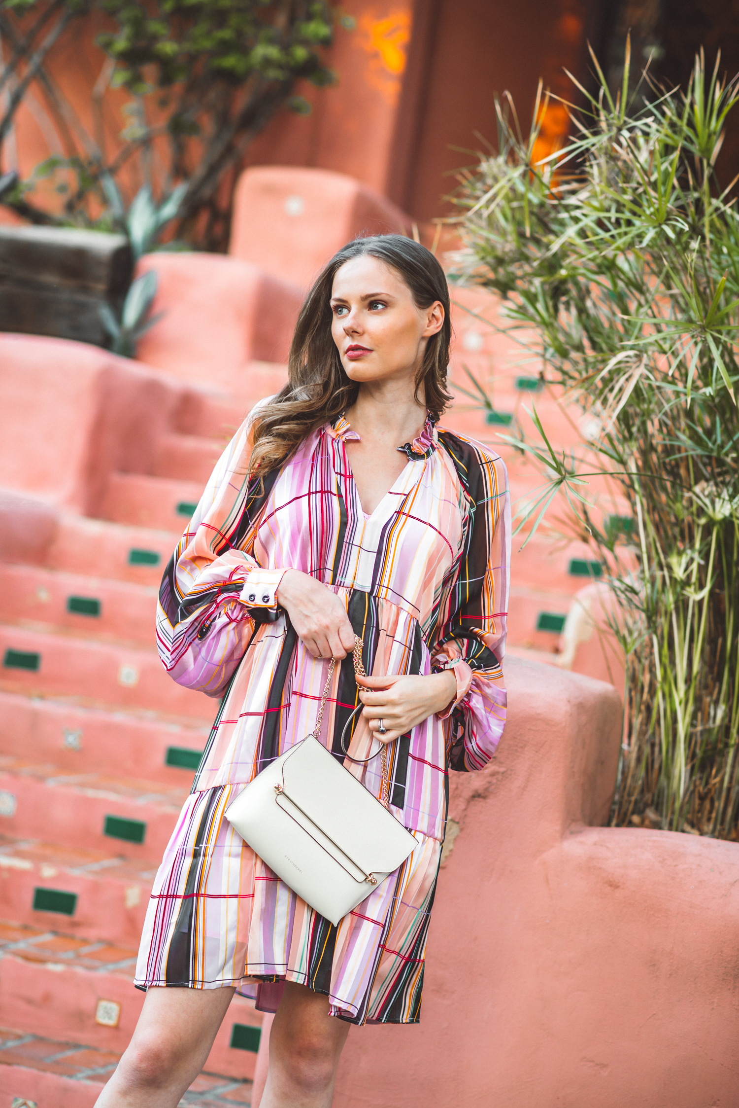 Alyssa Campanella of The A List blog shares 5 Danish brands to know wearing Stine Goya Jasmine dress and Strathberry stylist bag