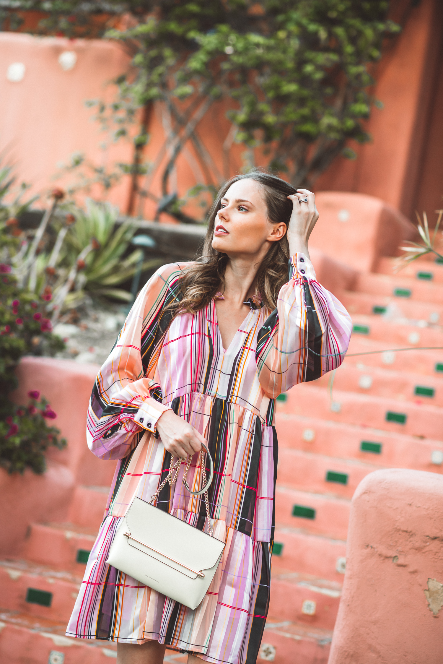 Alyssa Campanella of The A List blog shares 5 Danish brands to know wearing Stine Goya Jasmine dress and Strathberry stylist bag