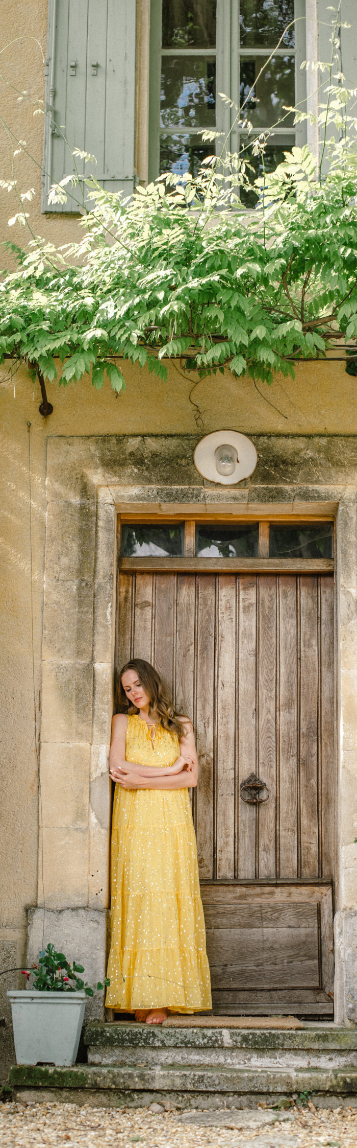 Alyssa Campanella of The A List blog wears Sézane yellow maxi dress at the Haven In villa in Bonnieux