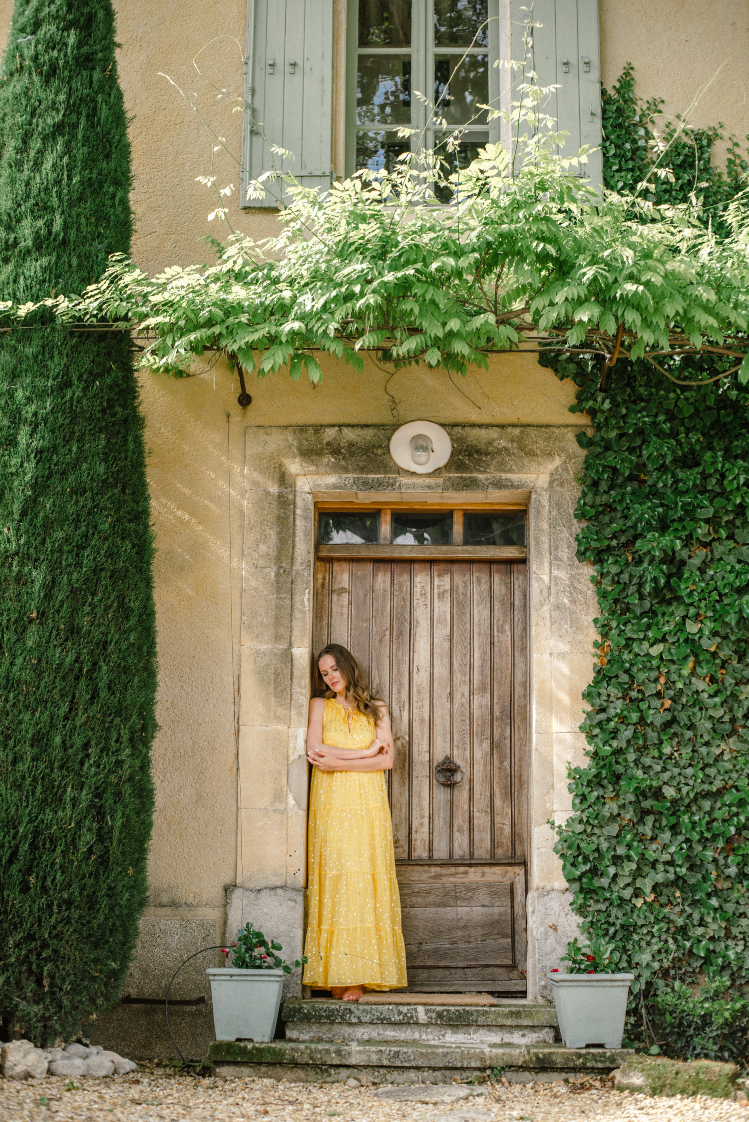Alyssa Campanella of The A List blog wears Sézane yellow maxi dress at the Haven In villa in Bonnieux