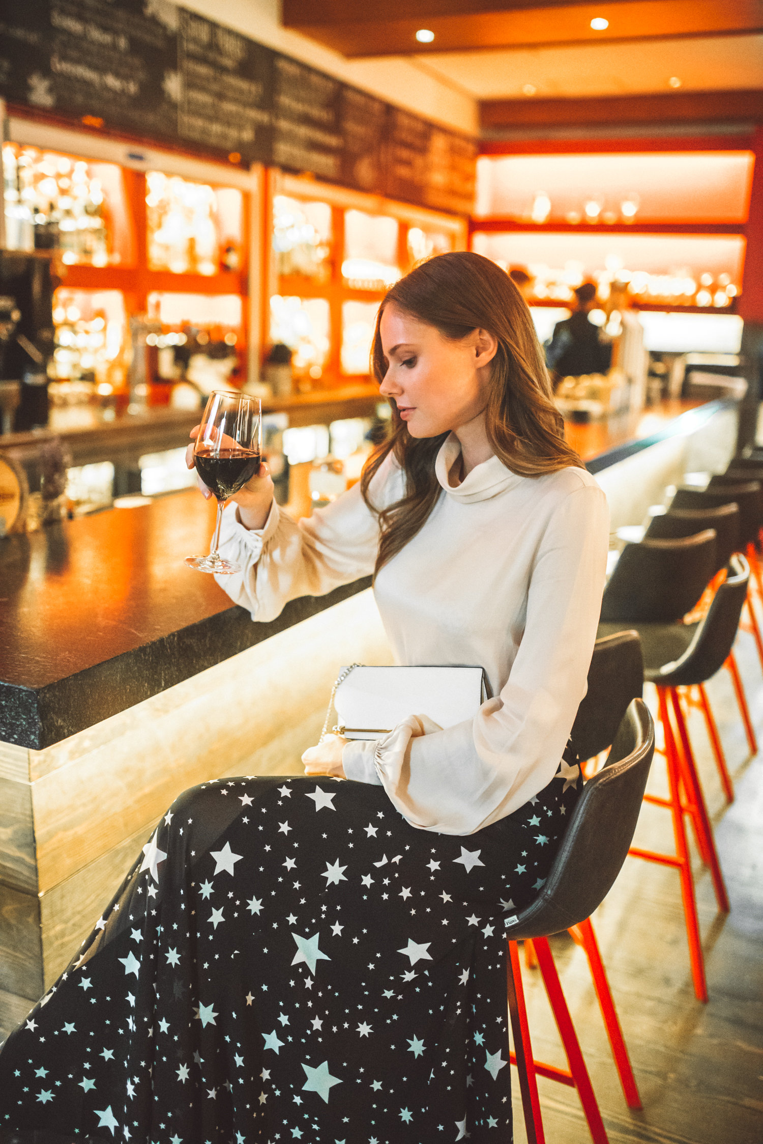 Alyssa Campanella of The A List shares her Whistler City Guide wearing LPA Top 340 and Lovers + Friends Hydra Skirt from Revolve at Cure Bar at Nita Lake Lodge