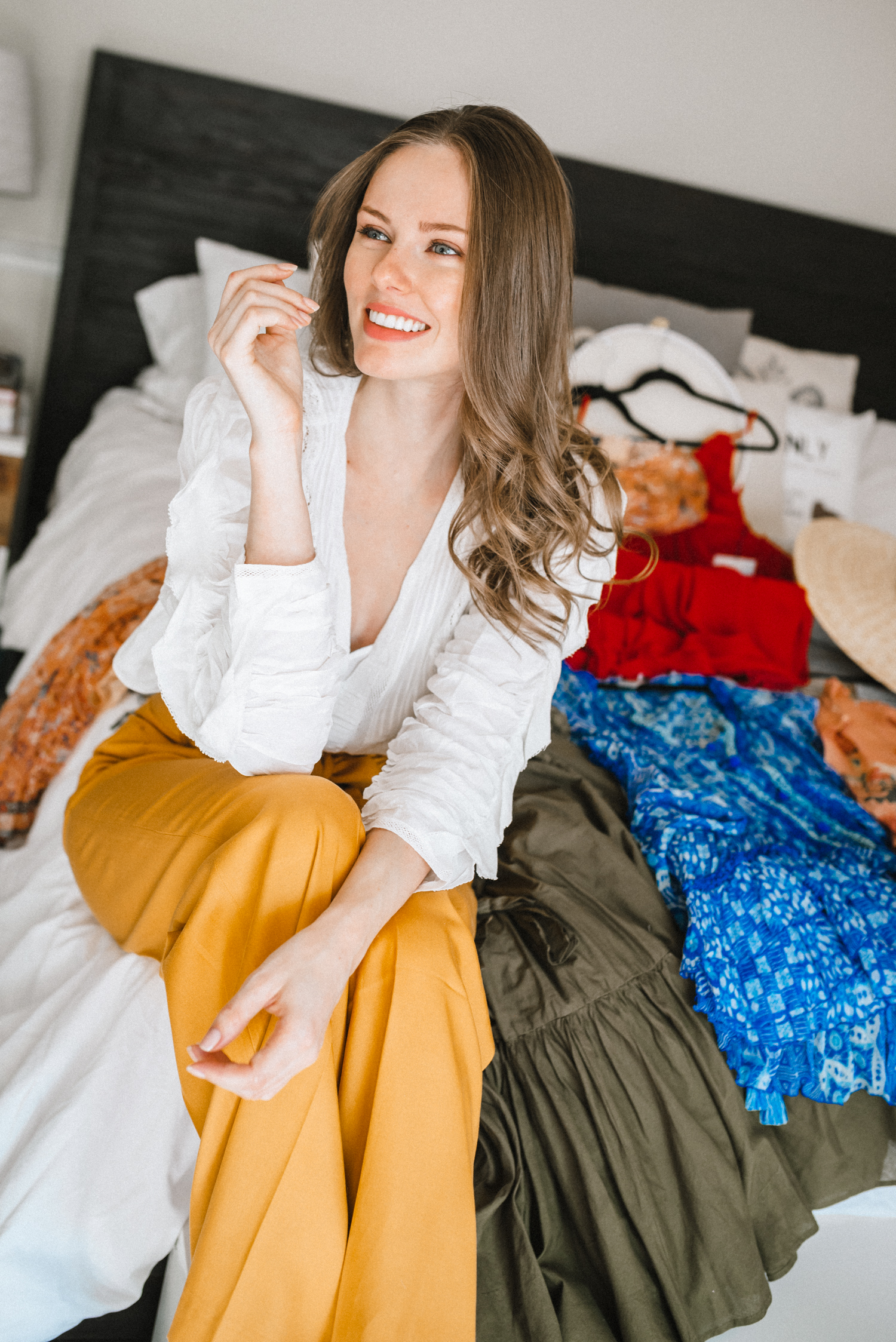 Former Miss USA 2011 Alyssa Campanella of The A List blog shares her Cayman Islands packing list with Hemant & Nandita and Jacquemus Santon hat wearing Sézane Arthur yellow pants