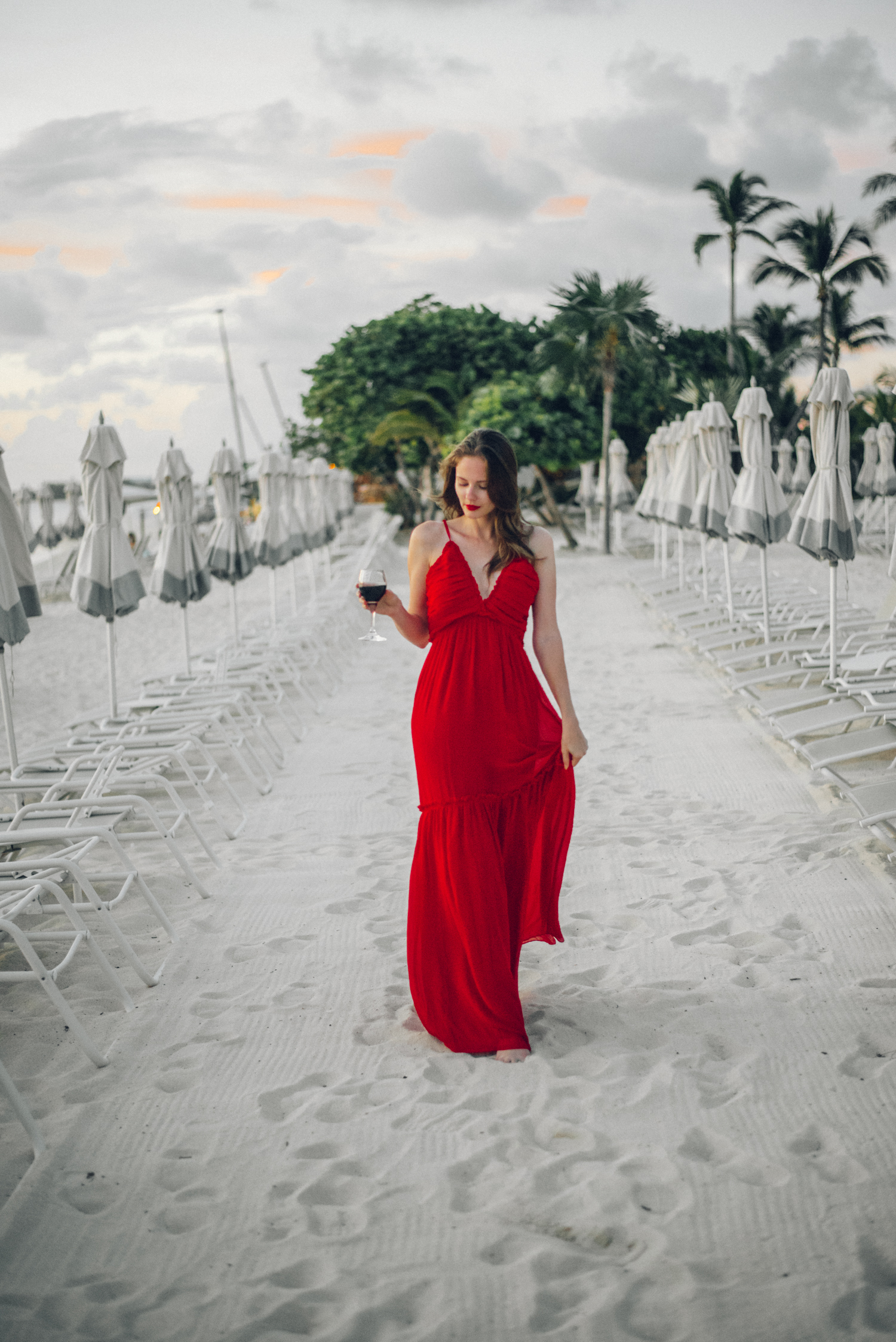 Alyssa Campanella of The A List blog visits Cayman Islands and stays at the Kimpton Seafire Resort wearing Majorelle Tony Gown from Revolve