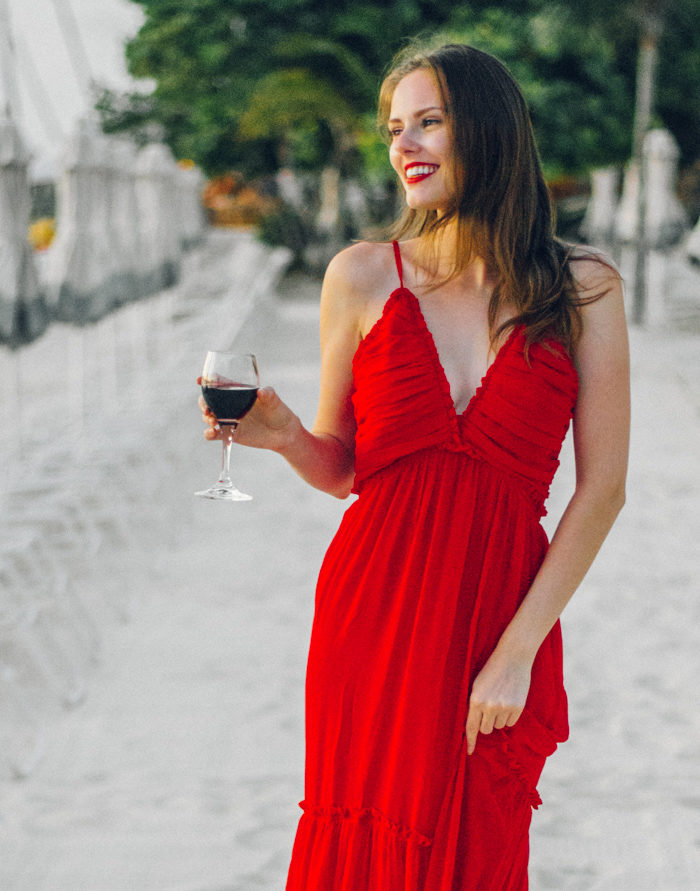 Alyssa Campanella of The A List blog visits Cayman Islands and stays at the Kimpton Seafire Resort wearing Majorelle Tony Gown from Revolve