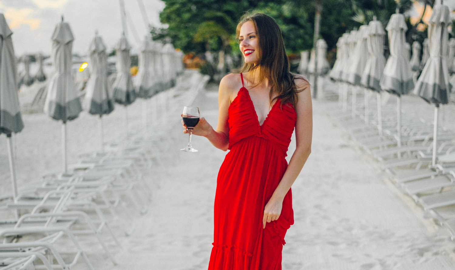 Alyssa Campanella of The A List blog visits Cayman Islands and stays at the Kimpton Seafire Resort wearing Majorelle Tony Gown from Revolve