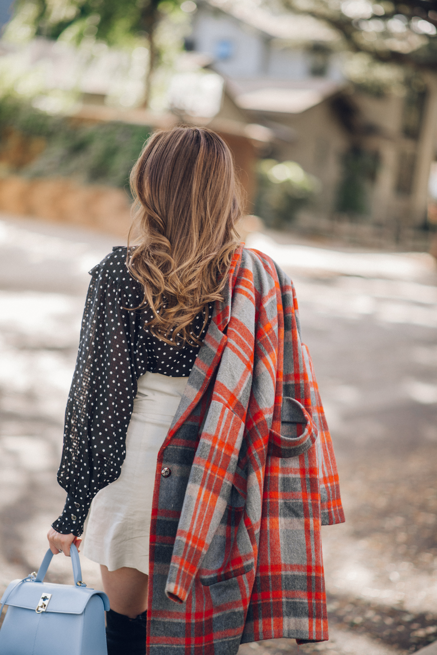 Alyssa Campanella of The A List blog shares her favorite plaid coats for fall wearing DRA plaid coat, Alexa Chung polka dot blouse, Lovers + Friends button up skirt, and Cafune small stance bag