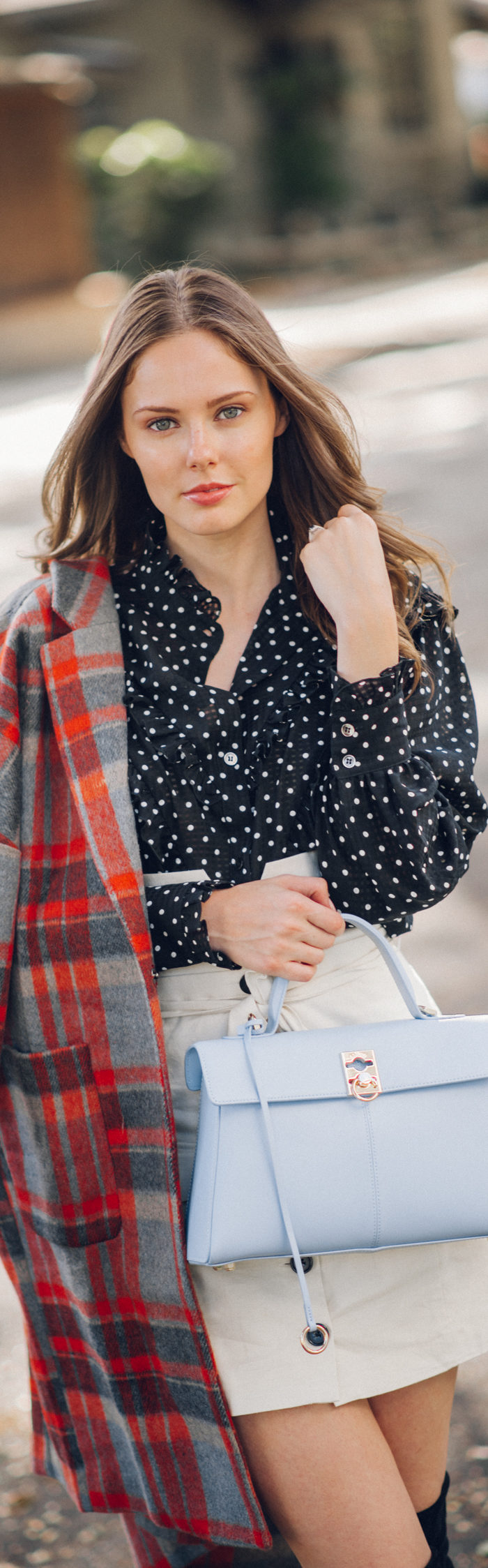 Alyssa Campanella of The A List blog shares her favorite plaid coats for fall wearing DRA plaid coat, Alexa Chung polka dot blouse, Lovers + Friends button up skirt, and Cafune small stance bag