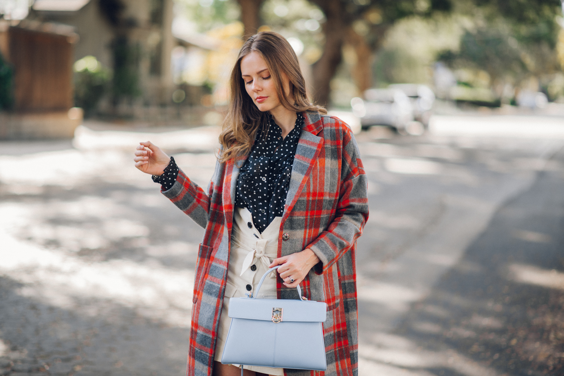 Alyssa Campanella of The A List blog shares her favorite plaid coats for fall wearing DRA plaid coat, Alexa Chung polka dot blouse, Lovers + Friends button up skirt, and Cafune small stance bag
