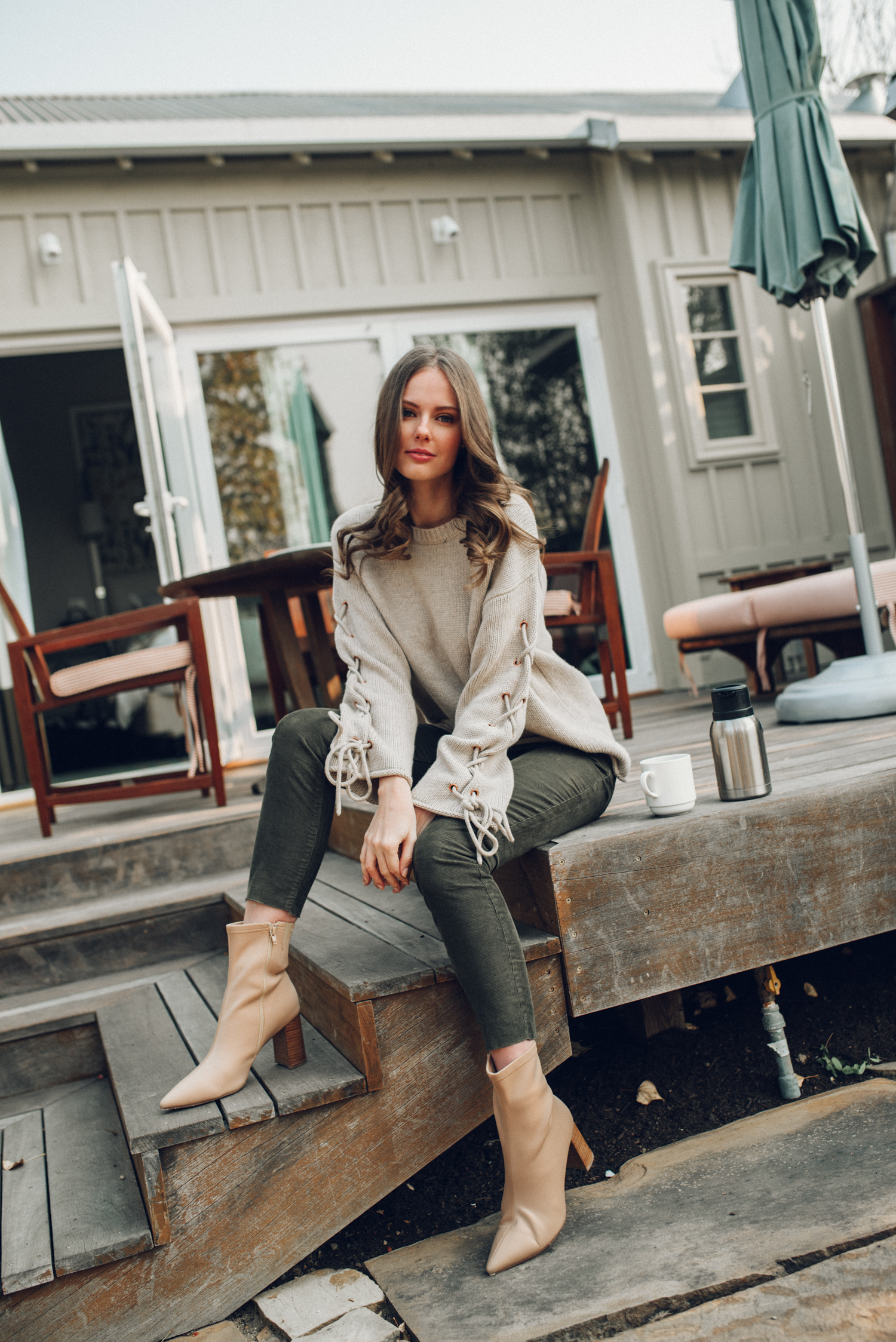 Alyssa Campanella of The A List blog visits Carneros Resort & Spa in November 2018 for cabernet season in a Harvest Cottage wearing See by Chloé lace up sleeve sweater and Jeffrey Campbell siren bootie