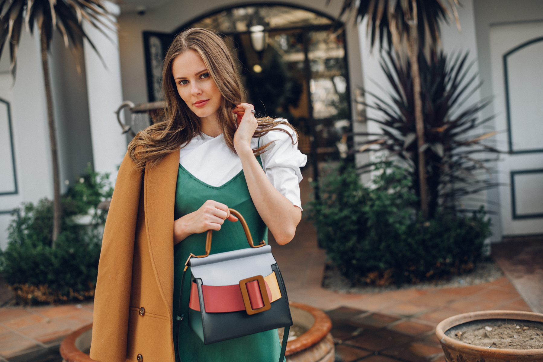 Alyssa Campanella of The A List blog shares why I limit what I post on social media wearing Boyy boutique Karl bag, Sezane James coat, and Sezane Pauline boots