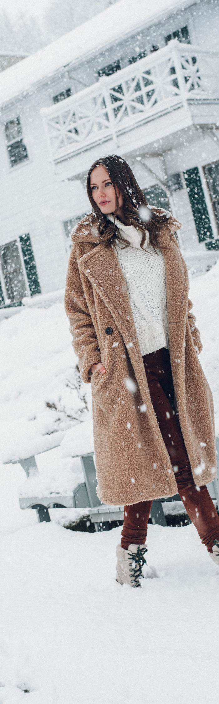 Alyssa Campanella of The A List blog visits Manoir Hovey in Québec wearing Storets Teddy Coat, Joseph suede pants, and Frye Samantha hiker boots