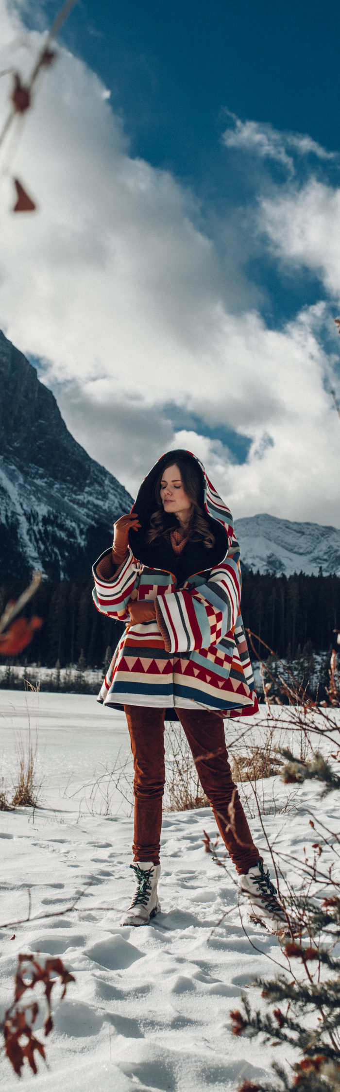 Alyssa Campanella of The A List blog sharing why I've stopped calling myself a blogger wearing Lindsey Thornburg cape in Alberta, Canada