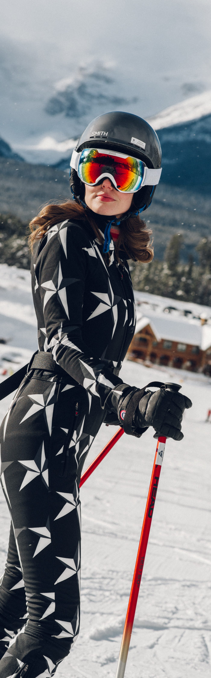 Alyssa Campanella of The A List blog experiences romance in the snow with her husband by skiing in Lake Louise, Alberta, Canada wearing Perfect Moment Star Ski Suit