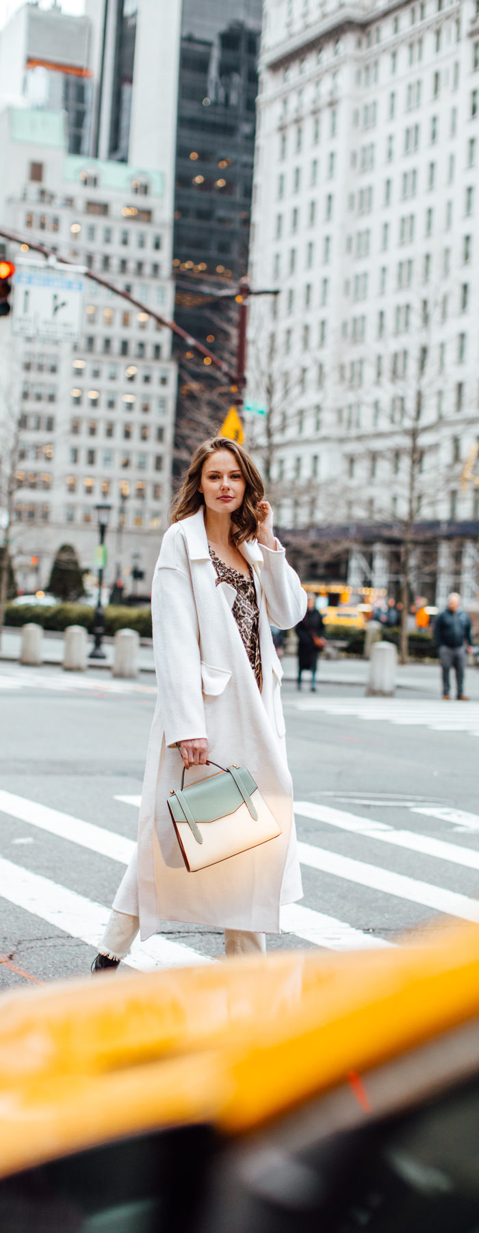 Alyssa Campanella of The A List blog shares her favorite restaurants in New York wearing Zimmermann suraya top, Strathberry midi allegro bag, and Miista yana boots.